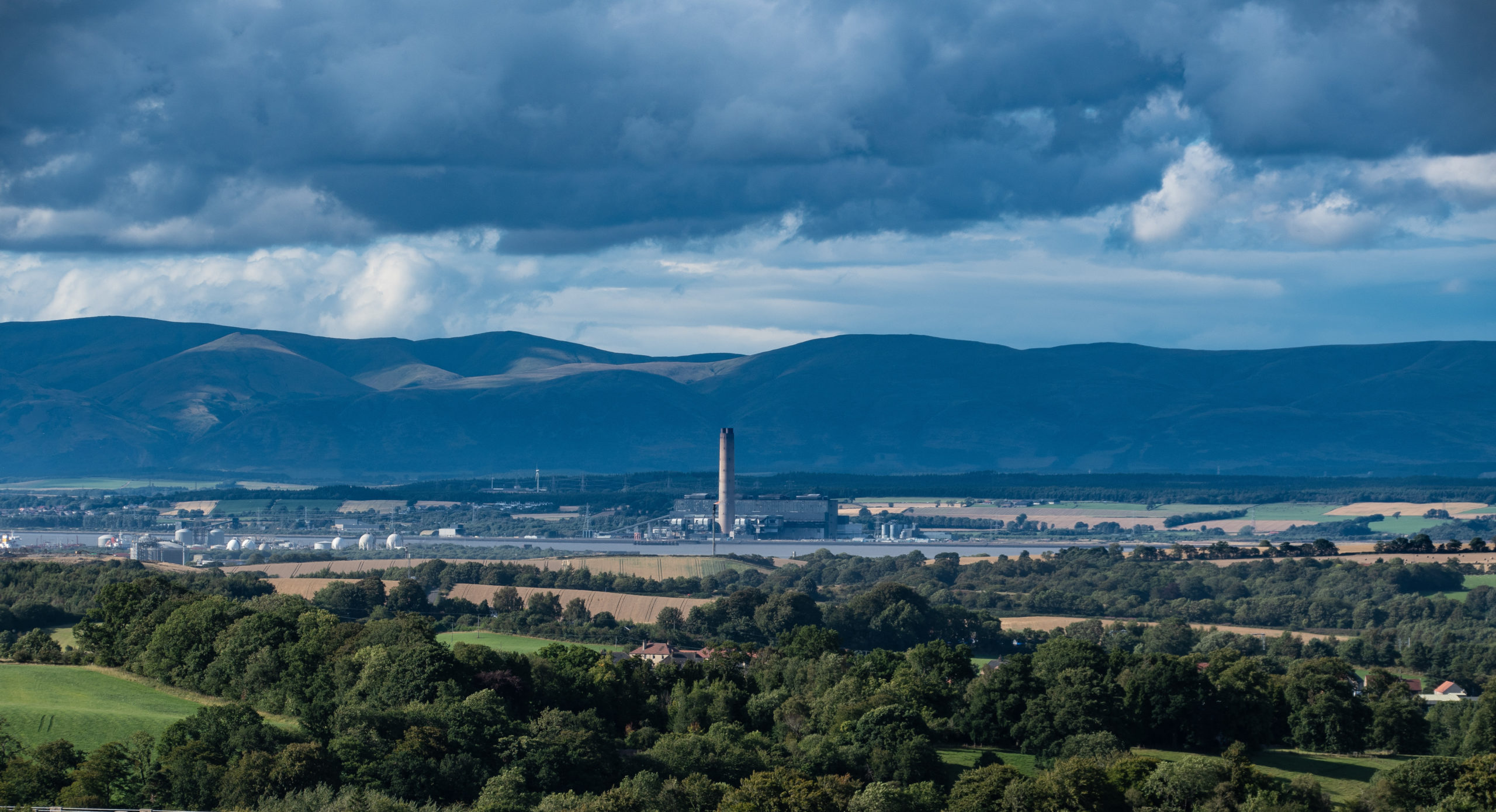 A landscape showing a factory on the banks of the Forth River